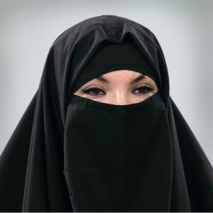 A human picked this image as the most visually anomalous because no one else were a burka in their portrait.