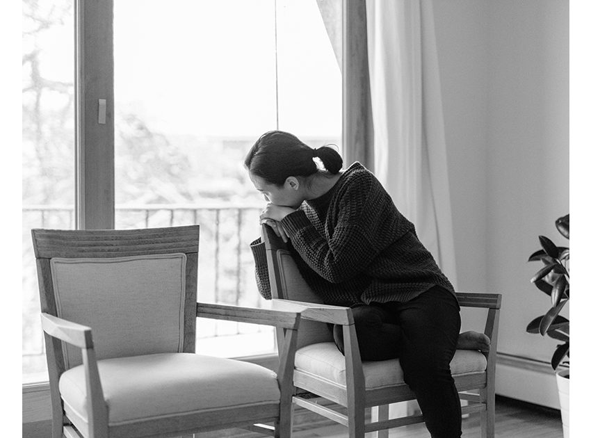 women sitting in front of windows