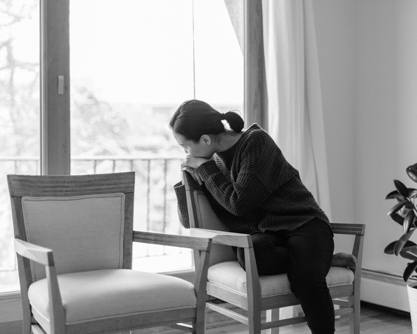 woman sitting by window